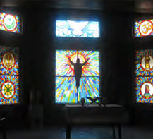 Stained glass depiction of Jesus inside church