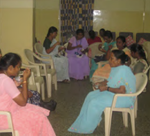 Group of Indian women sitting a circle talking